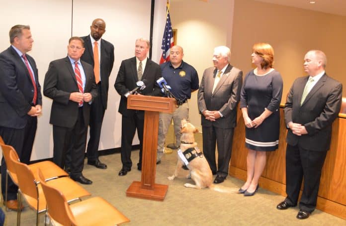 Pictured from left, Delaware County Councilmen Michael Culp, Dave White. Special Agent in Charge Marlon Miller of the U.S. Immigration and Customs Enforcement’s (ICE) Homeland Security Investigations’ (HSI), District Attorney Jack Whelan, Nat Evans, K9 handler and ICAC forensic analyst, Chairman Mario Civera, Jr., Vice Chair Colleen Morrone and Councilman John McBlain.
