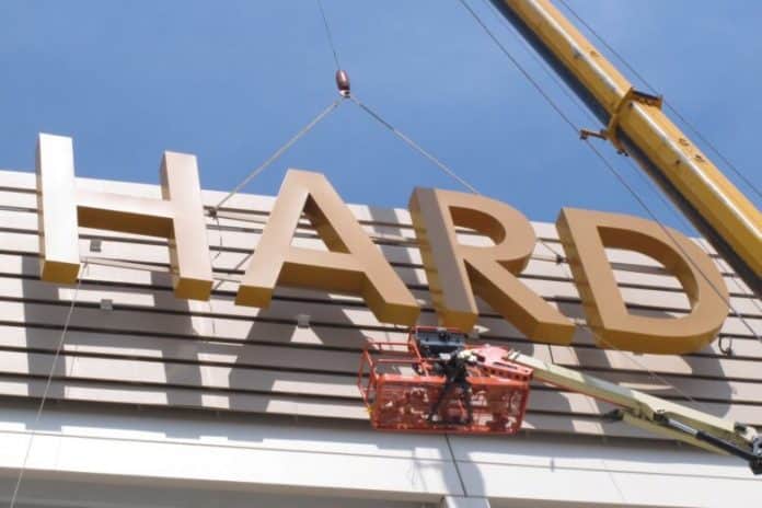 This Friday, May 4, 2018 photo shows part of the first sign for the soon-to-open Hard Rock Casino in Atlantic City N.J., being lifted into place on the building. As Atlantic City’s casinos mark their 40th anniversary, the industry is hailing the reopening of two of the five casinos that shut down since 2014, though some worry that re-expanding the market could lead to the same conditions that caused the closings in the first place. Hard Rock, which is the former Trump Taj Majal, and Ocean Resort, which is the former Revel, are both due to open on June 28. (Wayne Parry/Associated Press)