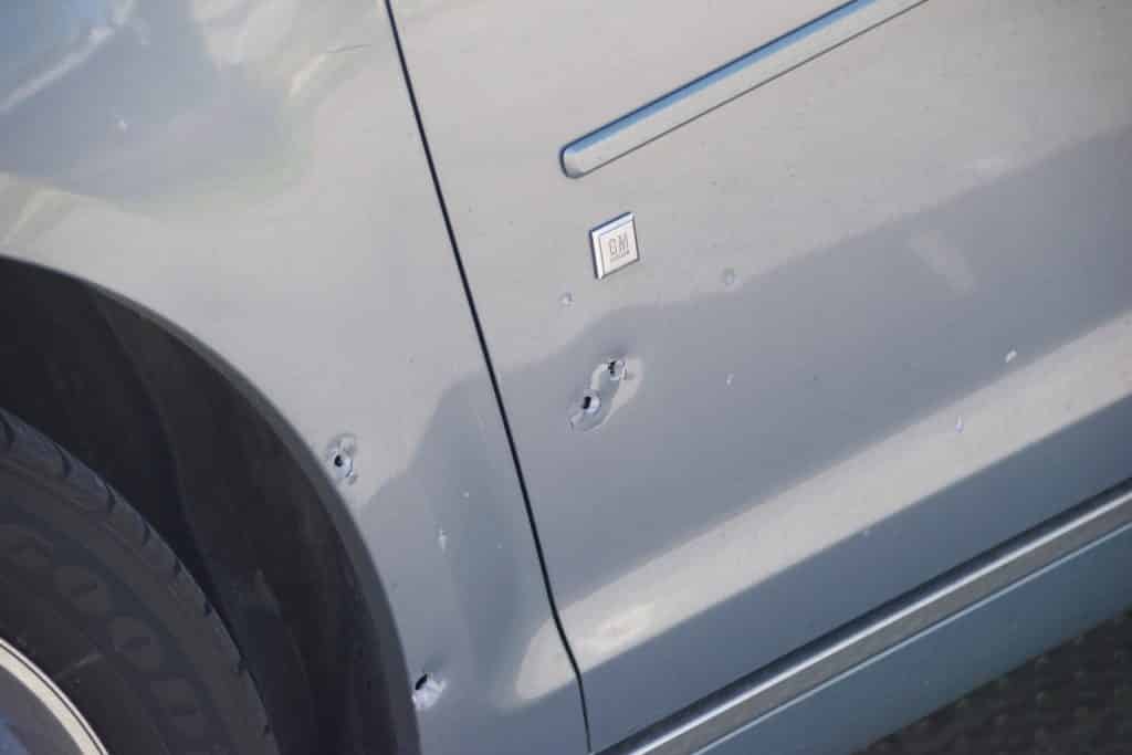 This silver Chevrolet was riddled with gunfire at the intersection of 9th and Booth Street in the City of Chester, Delaware County on Easter Sunday. (© YC.NEWS EXCLUSIVE/ERIC NORTON)